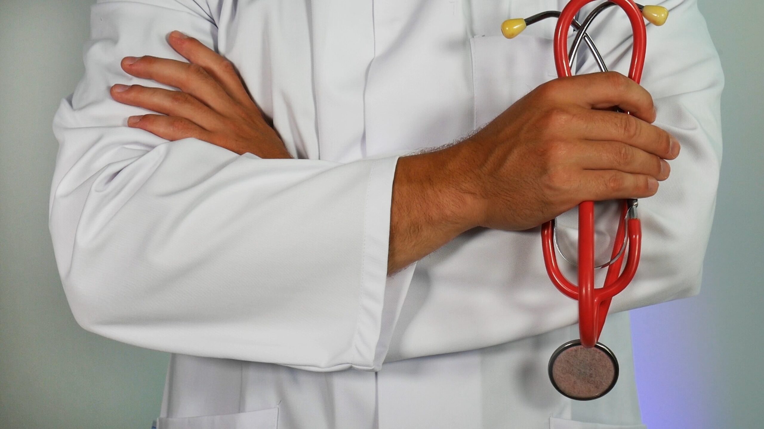 doctor-in-a-white-coat-holding-a-stethoscope