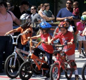 kids biking with helmets in maine