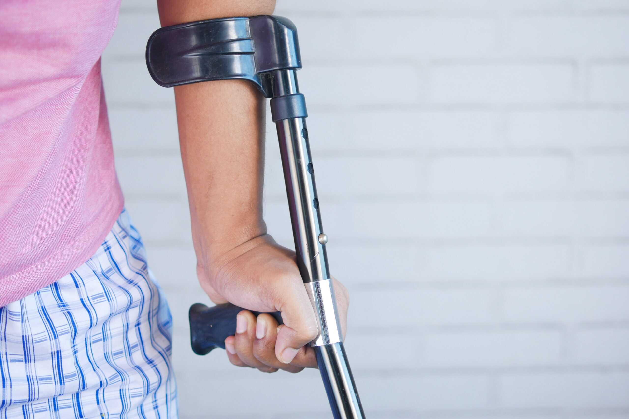 girl-holding-a-crutch